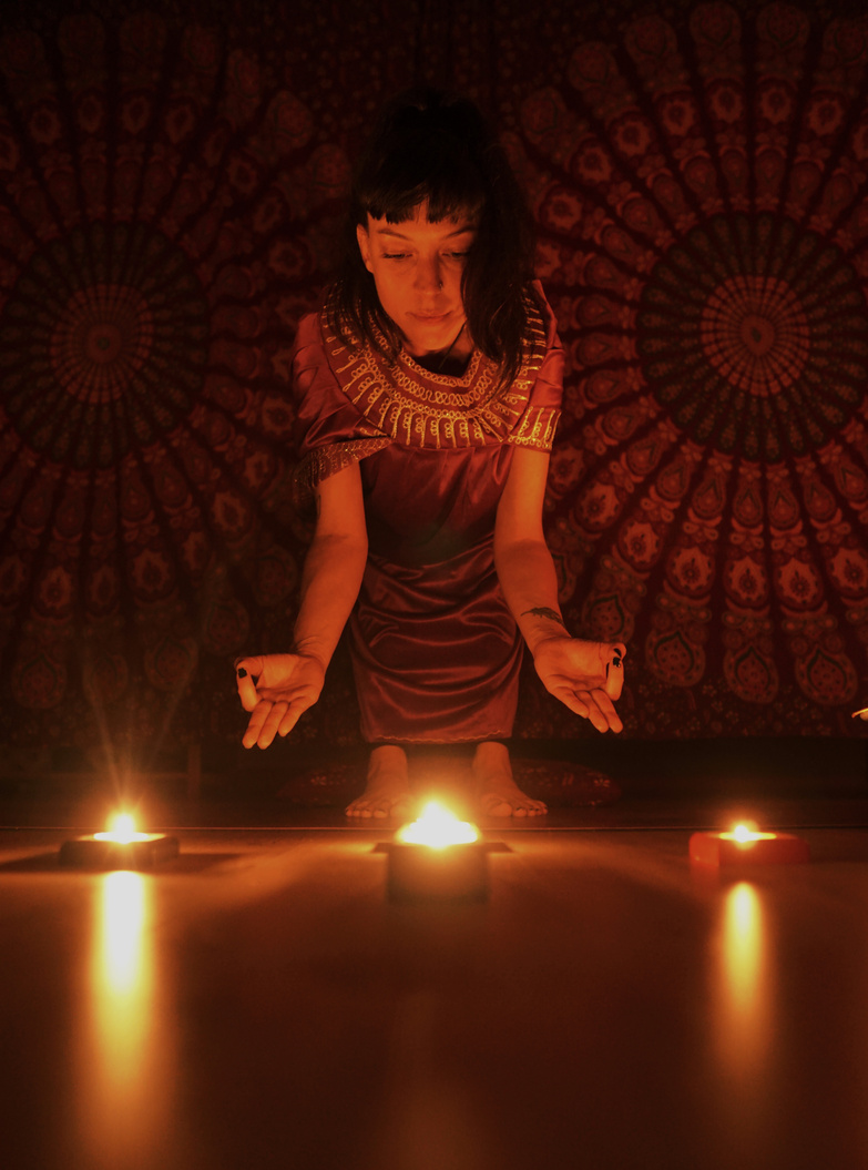 Woman looking at Lighted Candles 